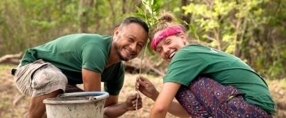 A Projects Abroad staff member and a student plant trees as part of their conservation volunteer work in Costa Rica. A volunteer and staff member work together on a reforestation initiative during Conservation volunteering in Costa Rica.